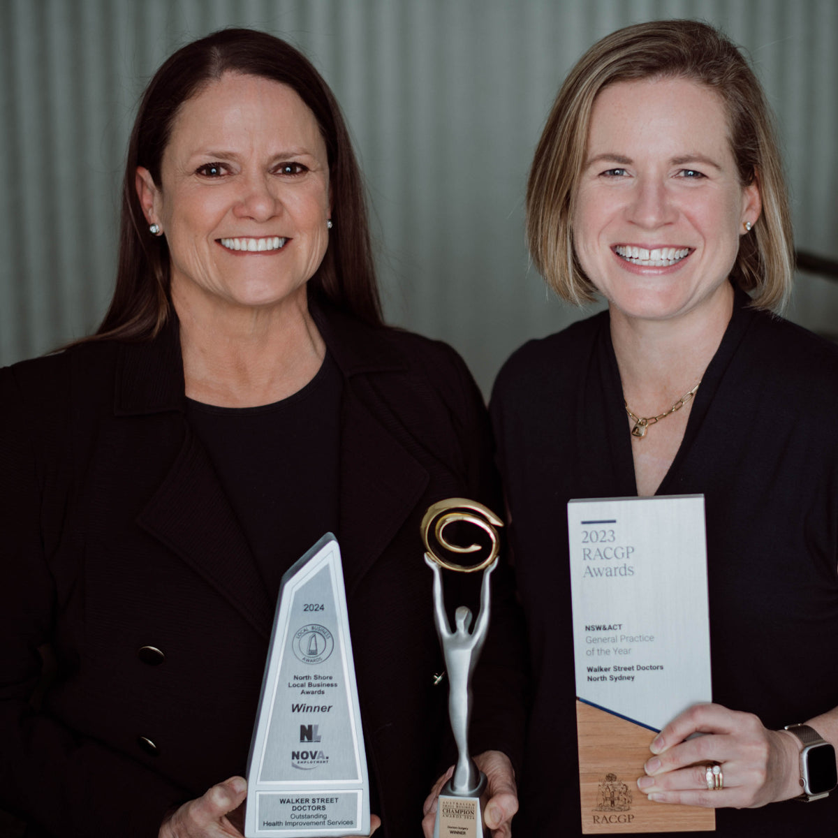 Nerida McDonald & Jess Rankin holding trophies
